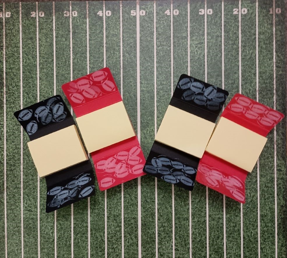 Black and Red Mini Sticky notepads on football field background image